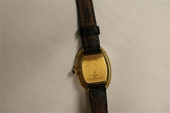 A ladys 18ct gold Cartier oval cased wrist watch, with Cartier box.
